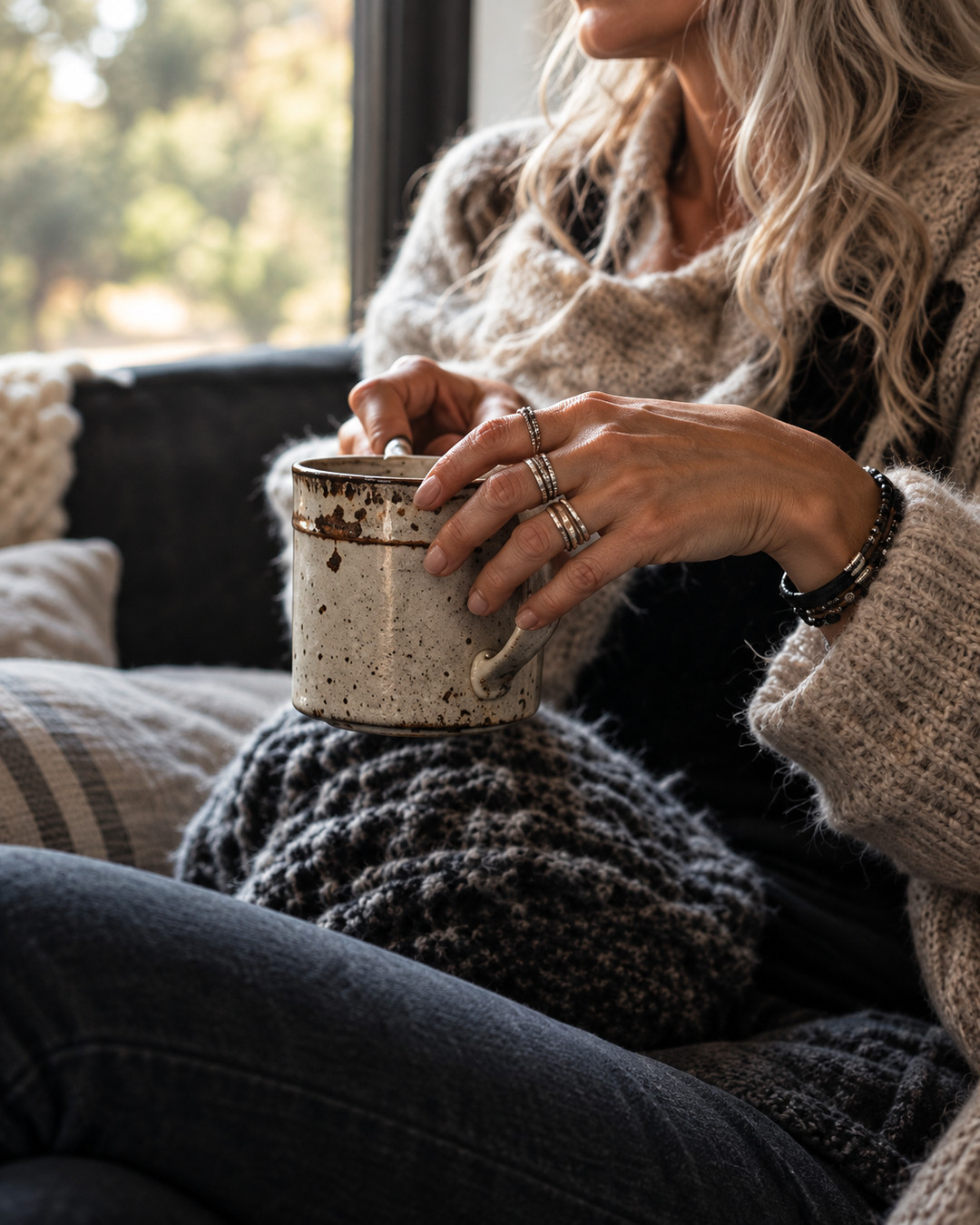 Grace Uncommon holding a ceramic mug during a quiet morning at home